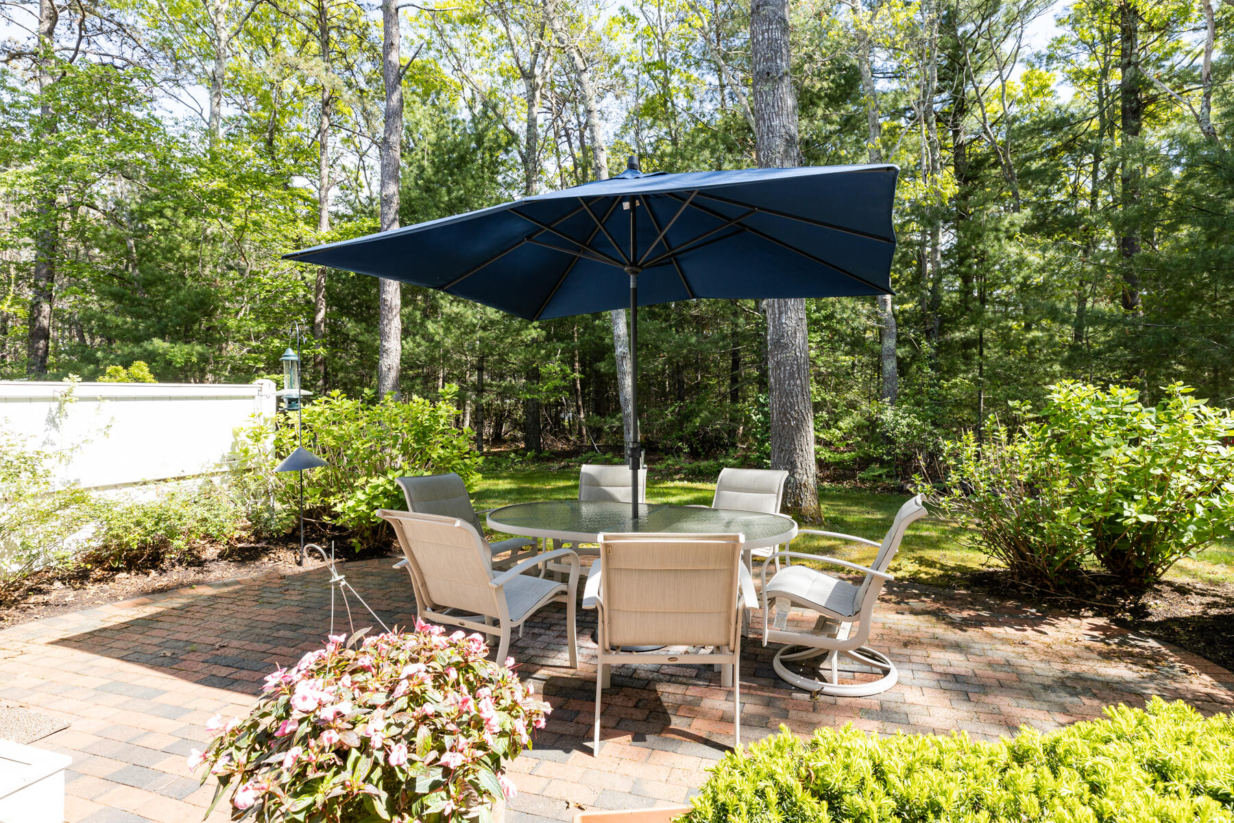 2 Bob White Crescent Mashpee, MA 02649 - Photo 39 of 47 a view of patio with table and chairs under an umbrella