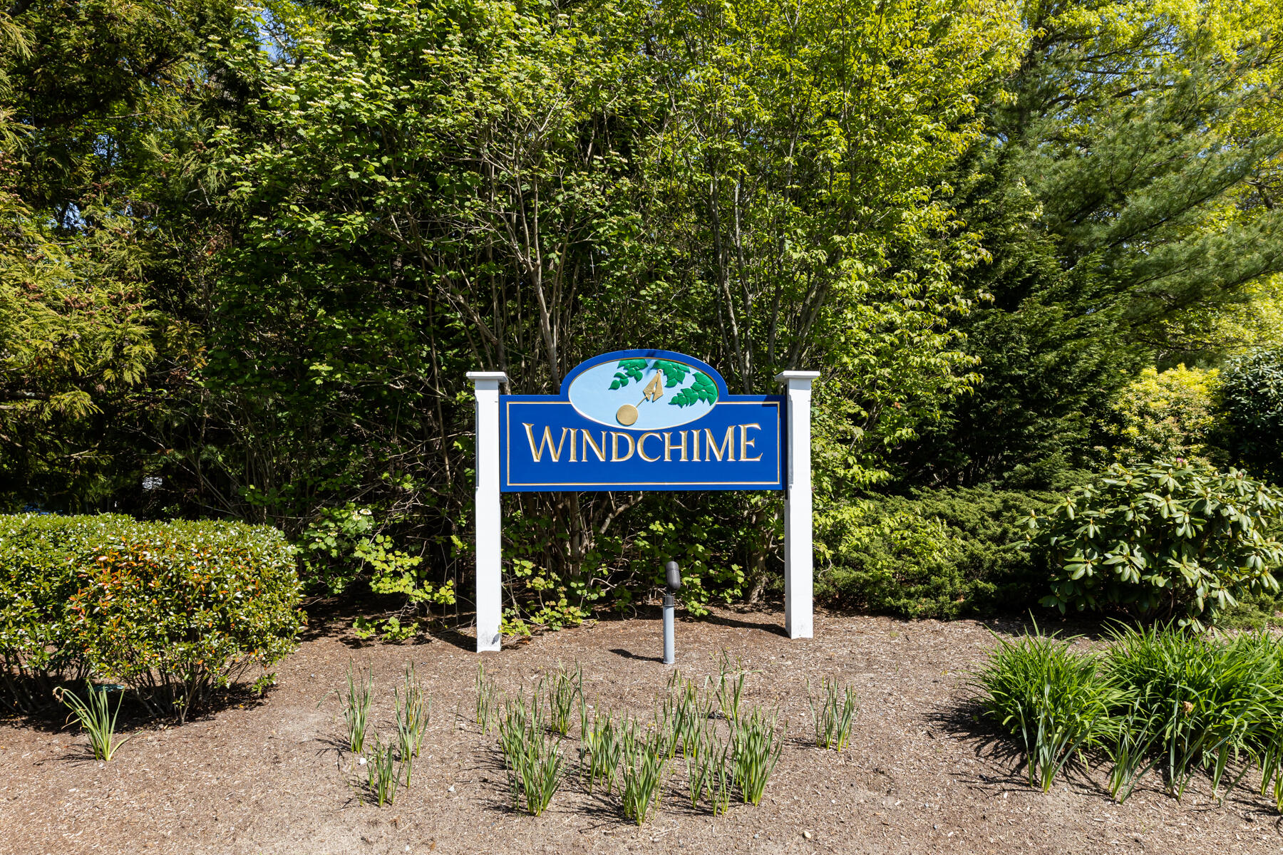 2 Bob White Crescent Mashpee, MA 02649 - Photo 45 of 47 a sign board with a house and trees in the background