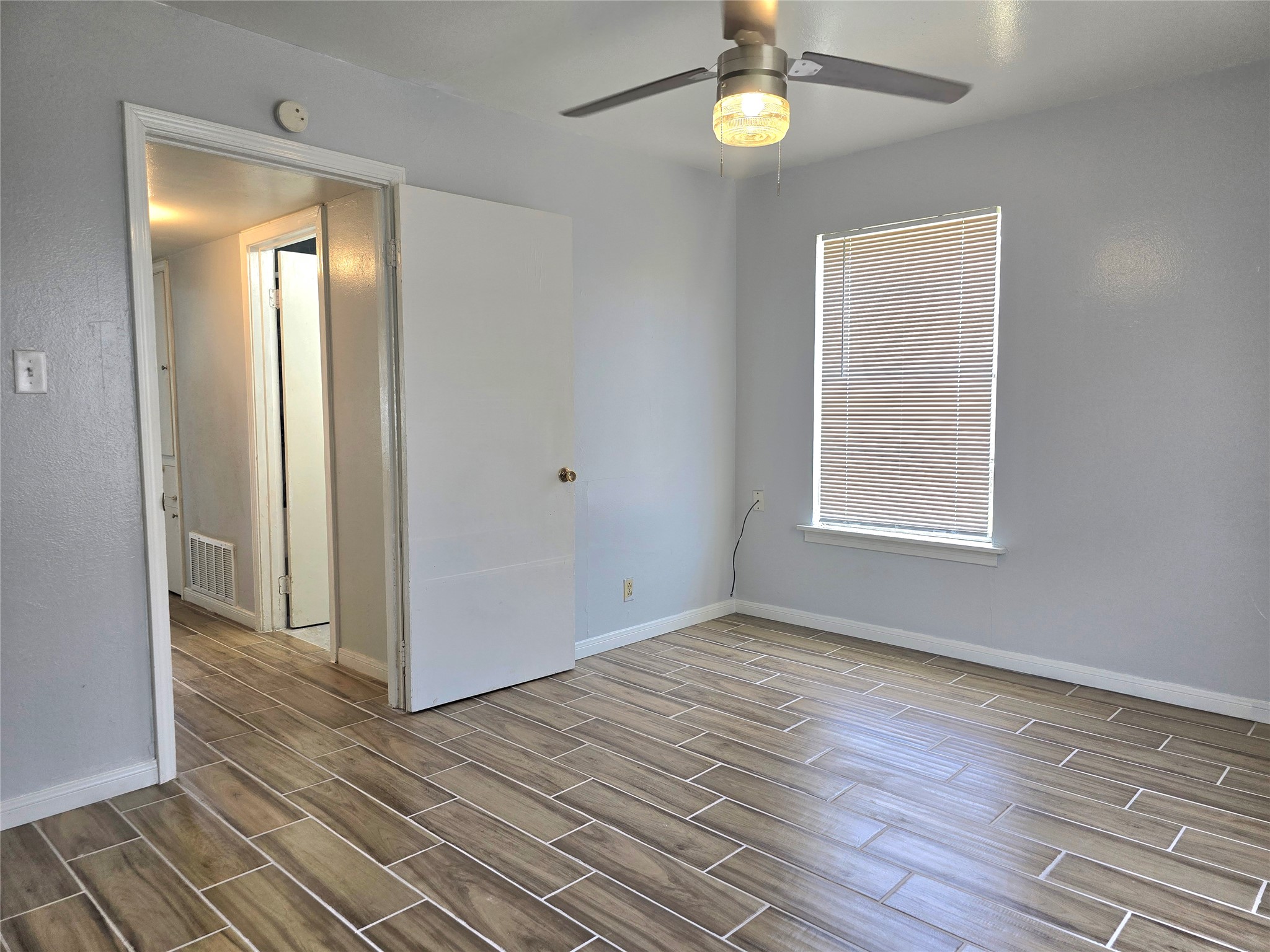 805 Sissom Road Killeen, TX 76541 - Photo 17 of 35 Empty room featuring wood tiled floors and ceiling fan