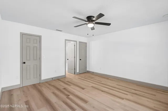 a view of a livingroom with a ceiling fan