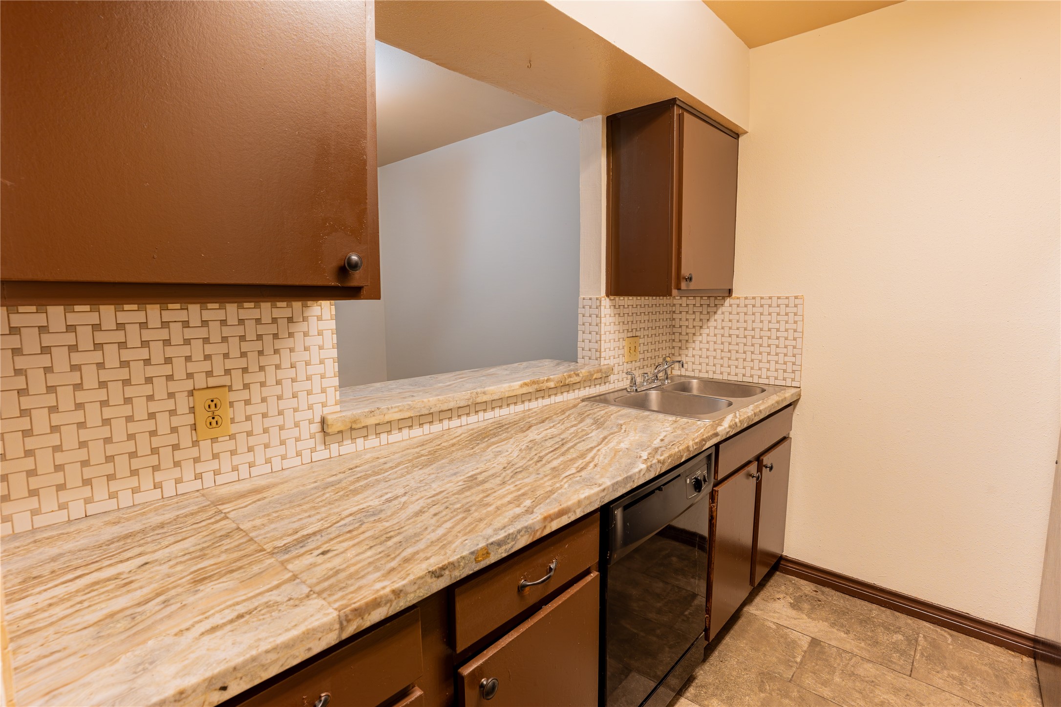 3314 Burke Road, Unit 39 Pasadena, TX 77504 - Photo 3 of 11 a bathroom with a granite countertop sink and a mirror