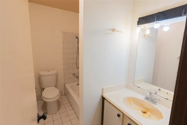 a bathroom with a toilet and a bathtub