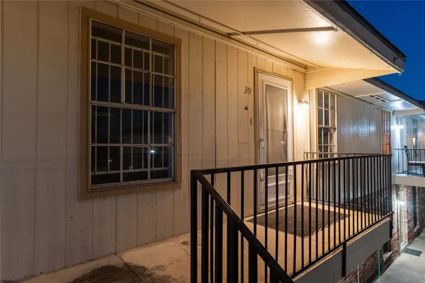 a kitchen with a refrigerator and a stove