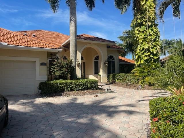 122 Dockside Circle Weston, FL 33327 - Photo 1 of 8 a front view of a house with a yard