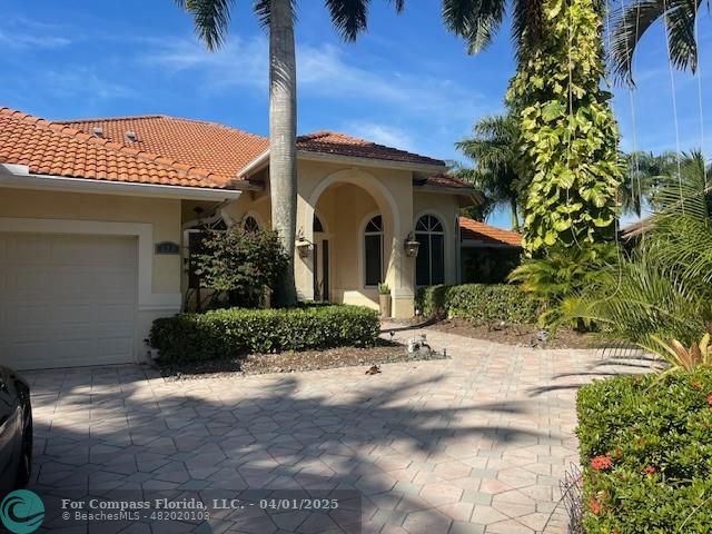 122 Dockside Circle Weston, FL 33327 - Photo 1 of 8 a front view of a house with a yard