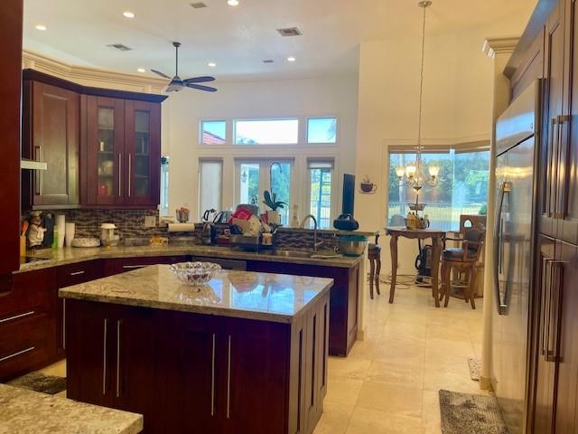 122 Dockside Circle Weston, FL 33327 - Photo 8 of 8 a large kitchen with a large counter top appliances and cabinets