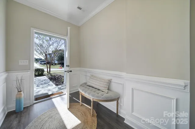 a large kitchen with a table and chairs