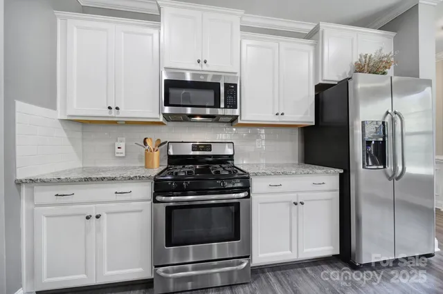 a room with wooden floor and furniture