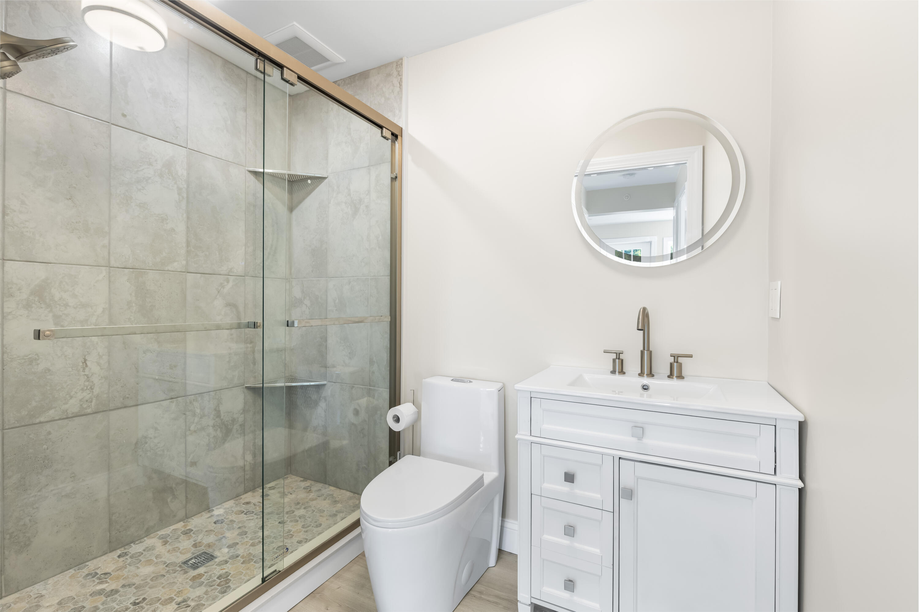 112 West Main Street, Unit 1 Barnstable, MA 02601 - Photo 12 of 15 a bathroom with a sink toilet and a mirror