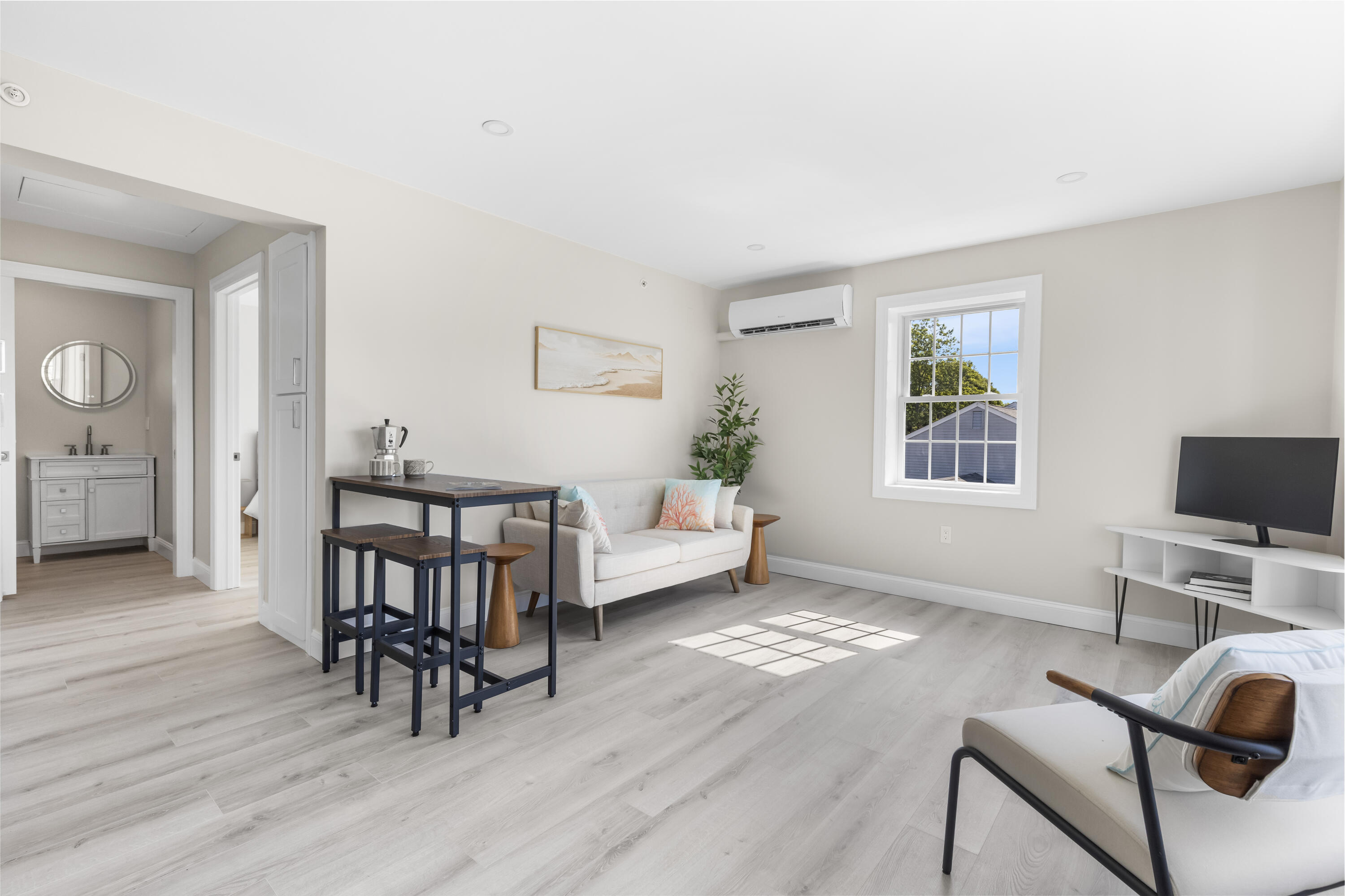 112 West Main Street, Unit 1 Barnstable, MA 02601 - Photo 2 of 15 a view of a livingroom with furniture and a flat screen tv