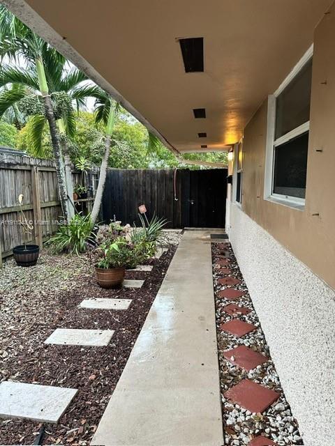620 Southwest 7th Avenue, Unit 2 Hallandale Beach, FL 33009 - Photo 1 of 23 a front view of a house with a yard
