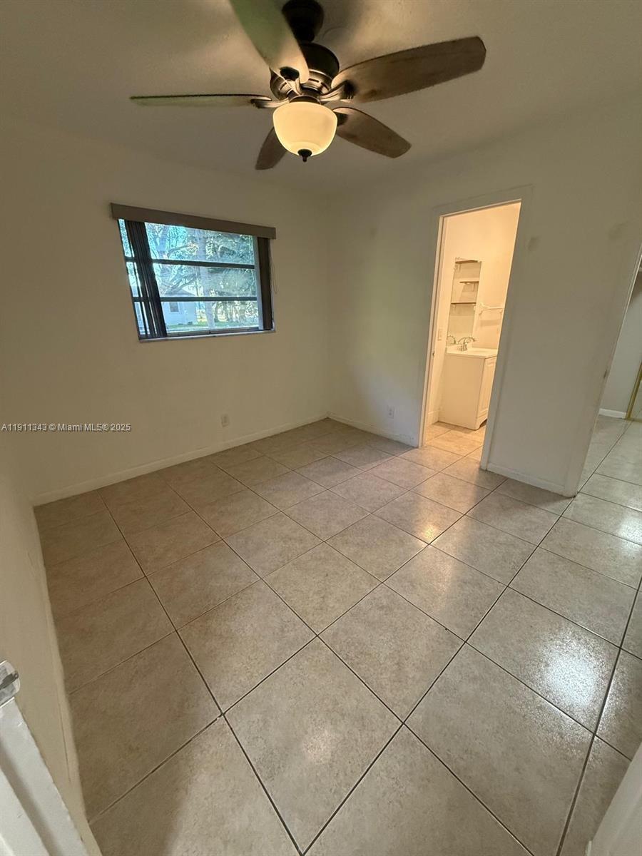 620 Southwest 7th Avenue, Unit 2 Hallandale Beach, FL 33009 - Photo 14 of 23 a view of an empty room with a window