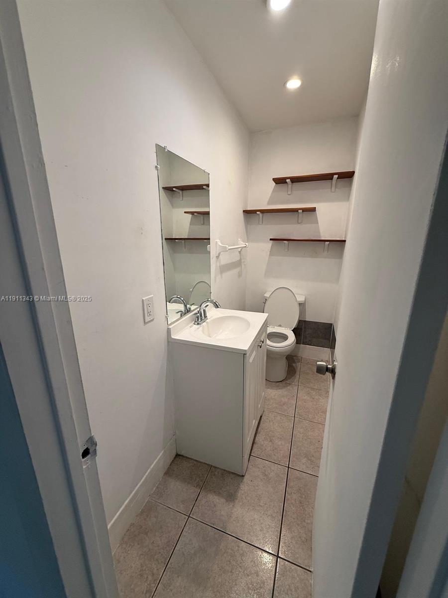 620 Southwest 7th Avenue, Unit 2 Hallandale Beach, FL 33009 - Photo 16 of 23 a room with a sink and cabinets