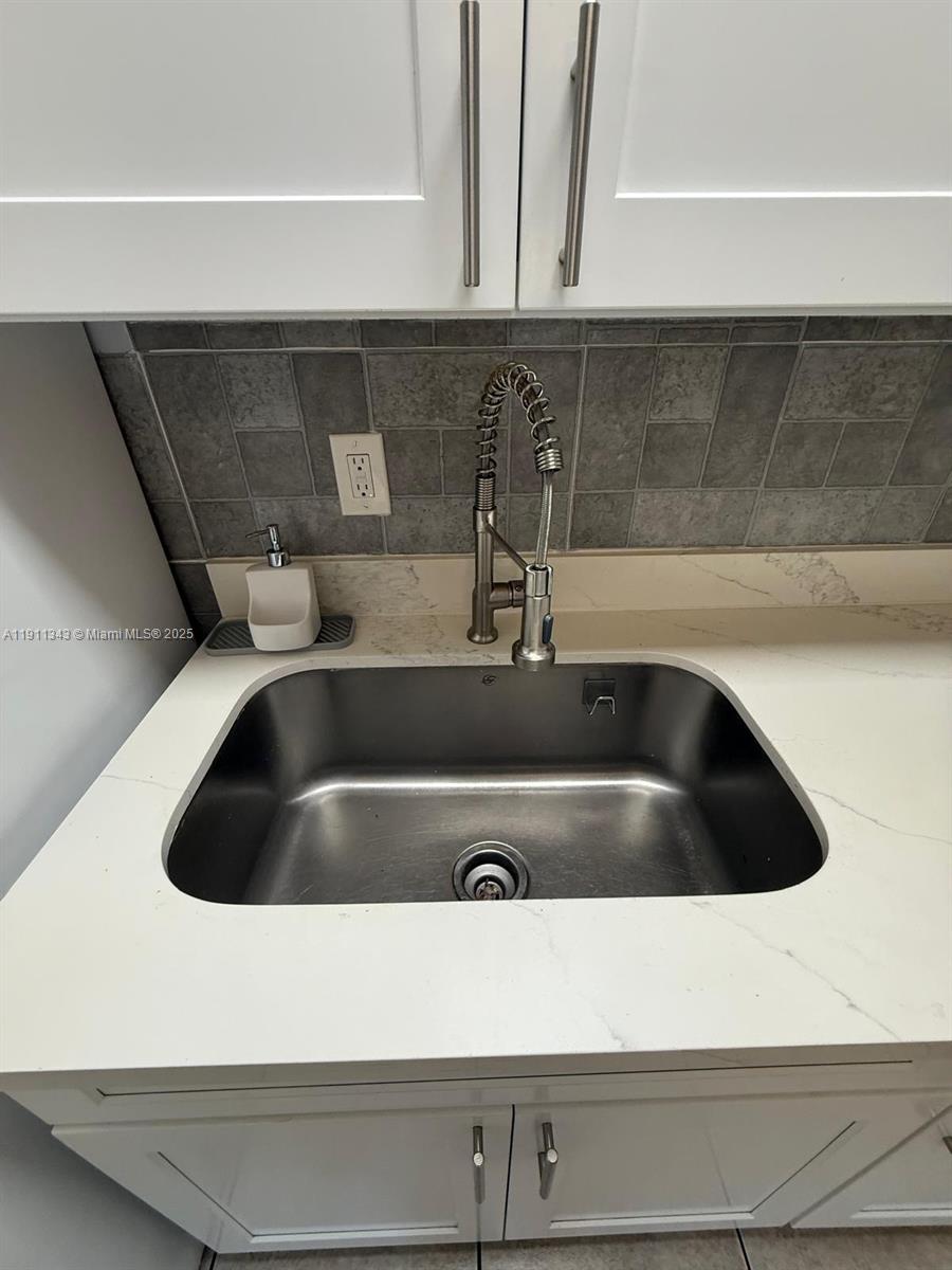620 Southwest 7th Avenue, Unit 2 Hallandale Beach, FL 33009 - Photo 10 of 23 a close view of sink and tap