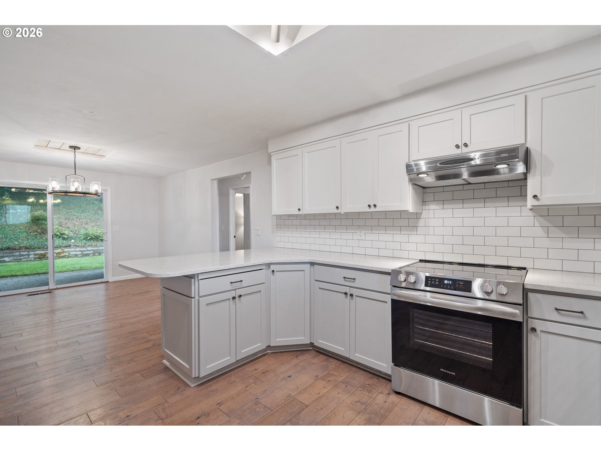 5546 Sinclair Street West Linn, OR 97068 - Photo 14 of 46 a kitchen with granite countertop a stove and a sink