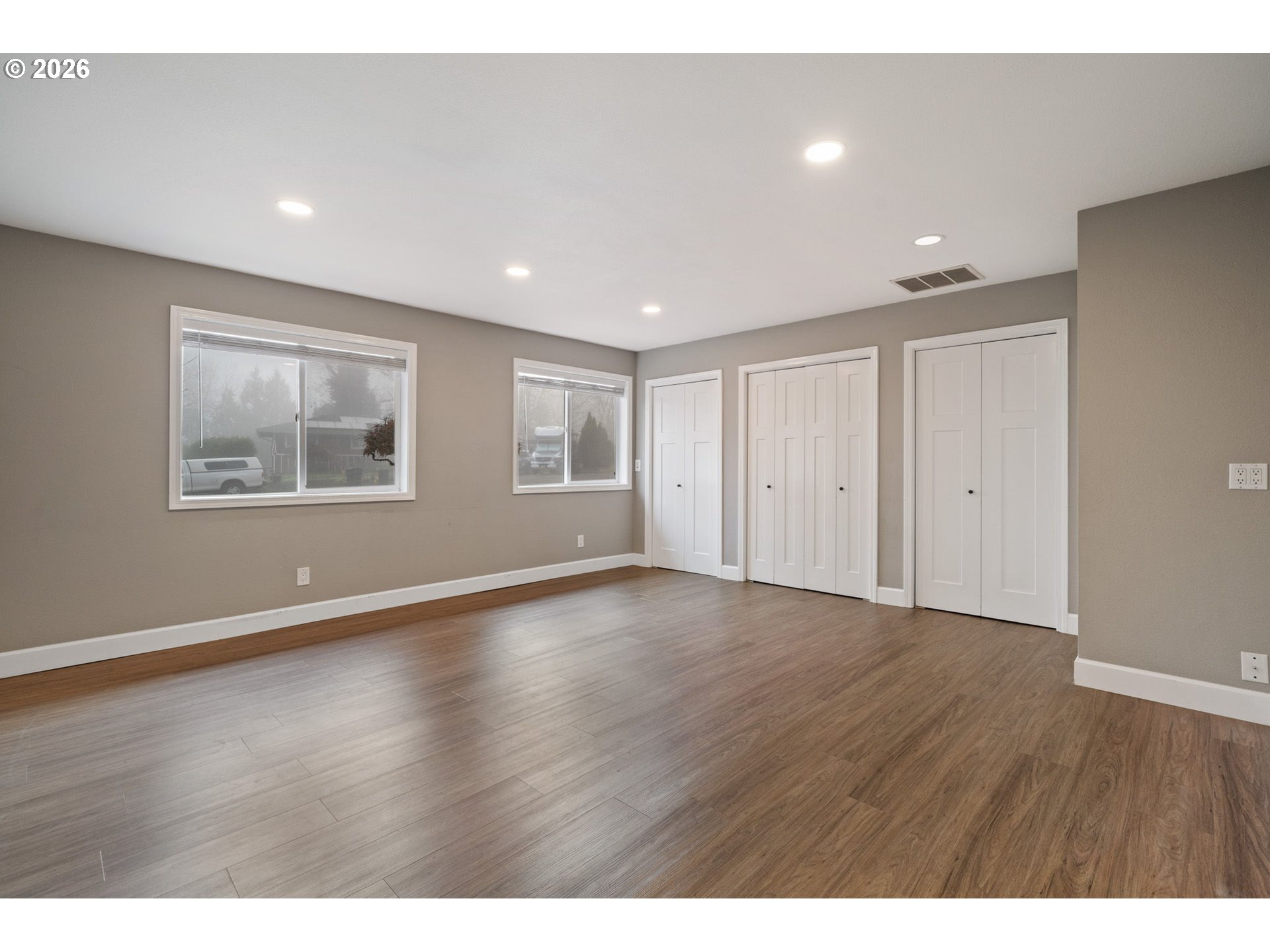 5546 Sinclair Street West Linn, OR 97068 - Photo 18 of 46 a view of an empty room with wooden floor and a window