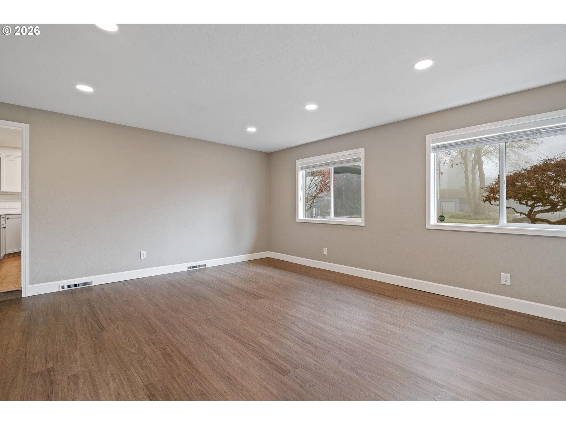 5546 Sinclair Street West Linn, OR 97068 - Photo 21 of 46 a view of an empty room with wooden floor and a window
