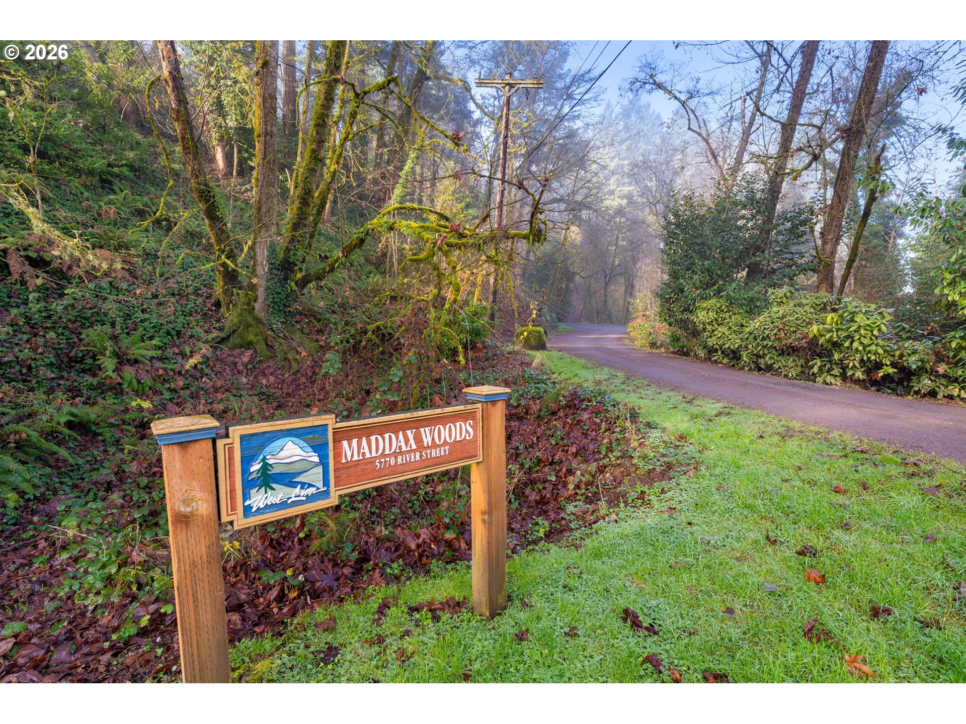 5546 Sinclair Street West Linn, OR 97068 - Photo 45 of 46 a view of a street sign under a large tree