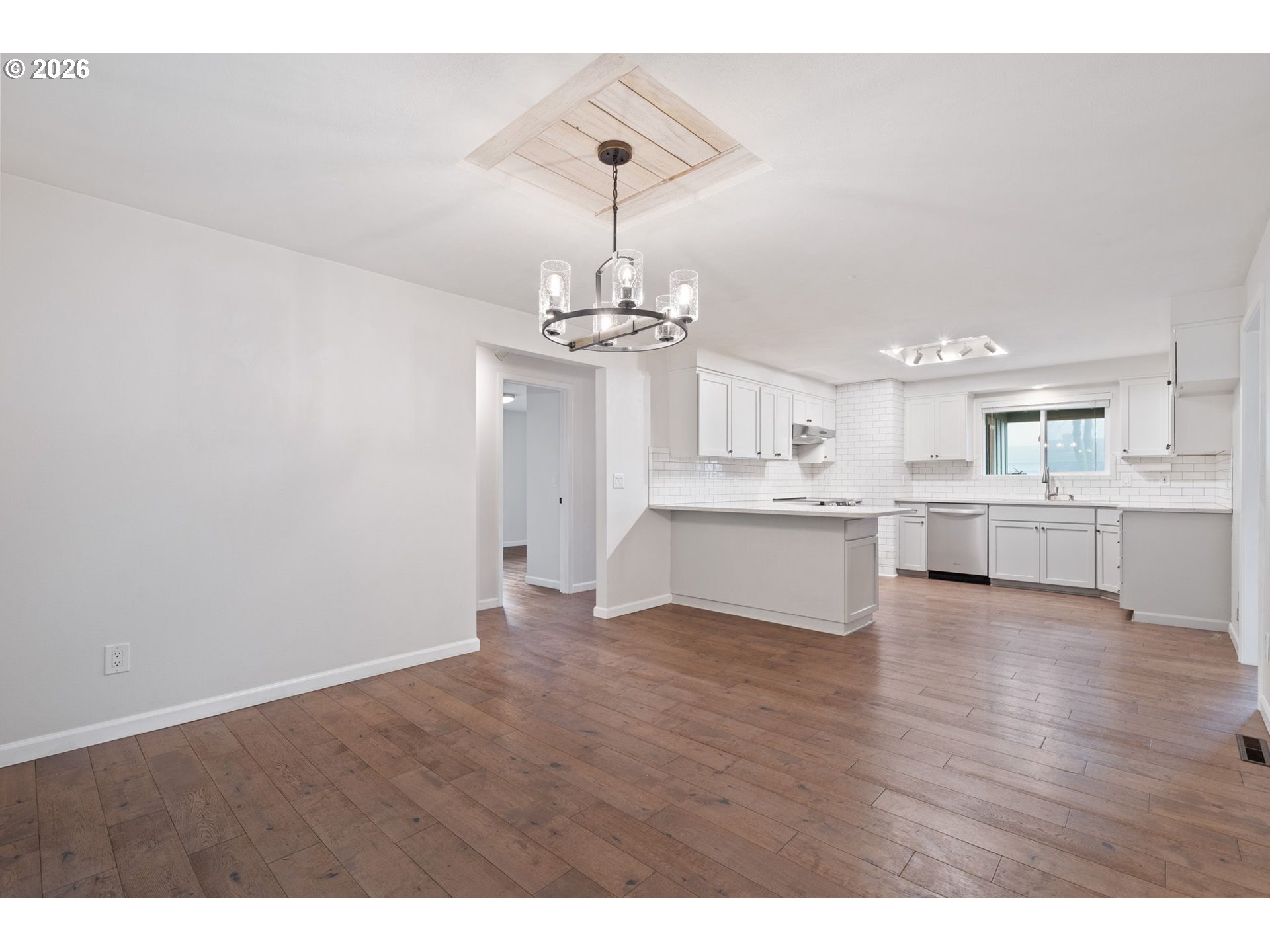 5546 Sinclair Street West Linn, OR 97068 - Photo 9 of 46 a view of a kitchen with a dishwasher cabinets and wooden floor