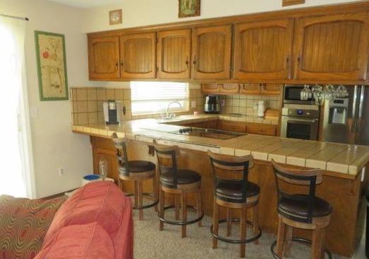 26681 Club Drive Madera, CA 93638 - Photo 11 of 41 a kitchen with stainless steel appliances granite countertop a sink and cabinets