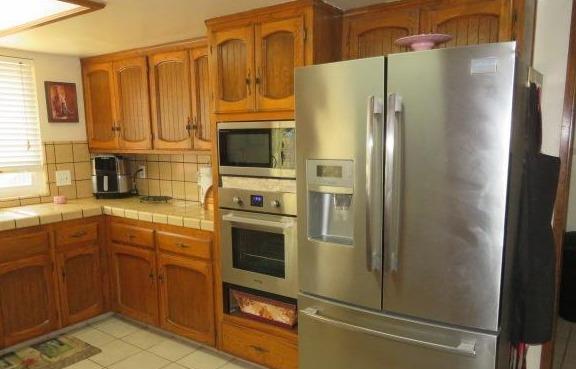 26681 Club Drive Madera, CA 93638 - Photo 16 of 41 a kitchen with stainless steel appliances granite countertop a refrigerator stove and sink