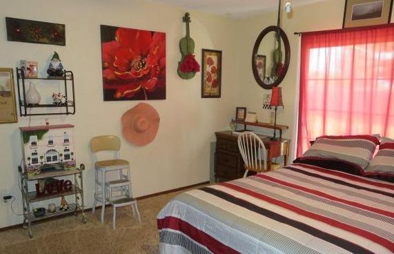 26681 Club Drive Madera, CA 93638 - Photo 17 of 41 a bedroom with a bed and a window