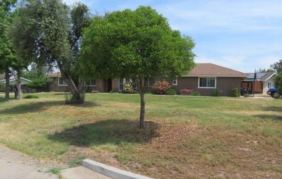 26681 Club Drive Madera, CA 93638 - Photo 2 of 41 a view of a house with a yard