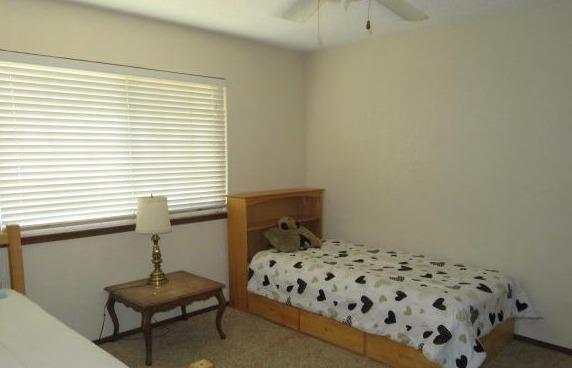 26681 Club Drive Madera, CA 93638 - Photo 24 of 41 a bedroom with a bed and a window