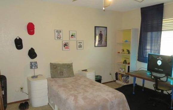 26681 Club Drive Madera, CA 93638 - Photo 25 of 41 a bedroom with a bed and a window