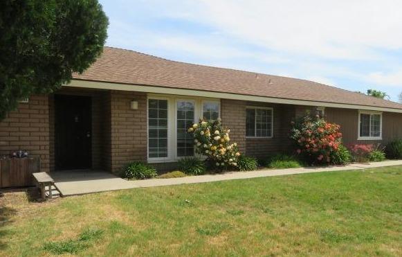 26681 Club Drive Madera, CA 93638 - Photo 3 of 41 a view of a house with backyard and garden