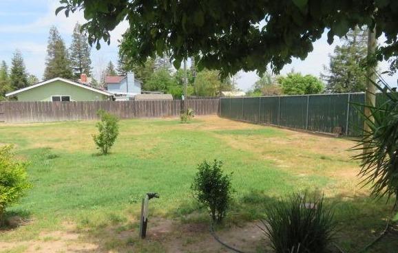 26681 Club Drive Madera, CA 93638 - Photo 34 of 41 a backyard of a house with lots of green space