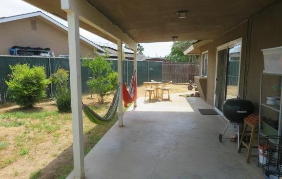 26681 Club Drive Madera, CA 93638 - Photo 35 of 41 a view of a two chair in the patio and a backyard