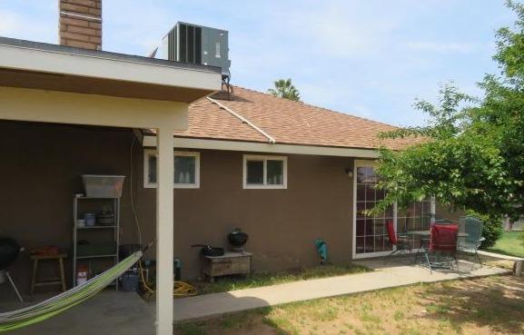 26681 Club Drive Madera, CA 93638 - Photo 39 of 41 a backyard of a house with table and chairs