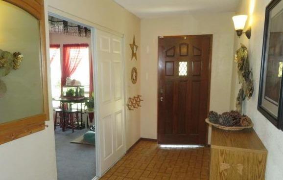 26681 Club Drive Madera, CA 93638 - Photo 4 of 41 a view of a hallway and a livingroom with furniture