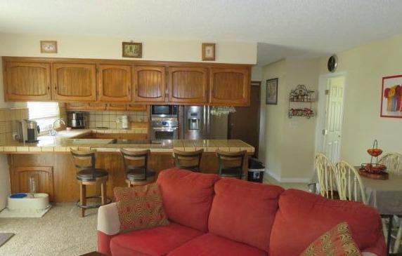 26681 Club Drive Madera, CA 93638 - Photo 10 of 41 a living room with blue lights with furniture