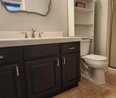 a bathroom with a sink toilet and vanity