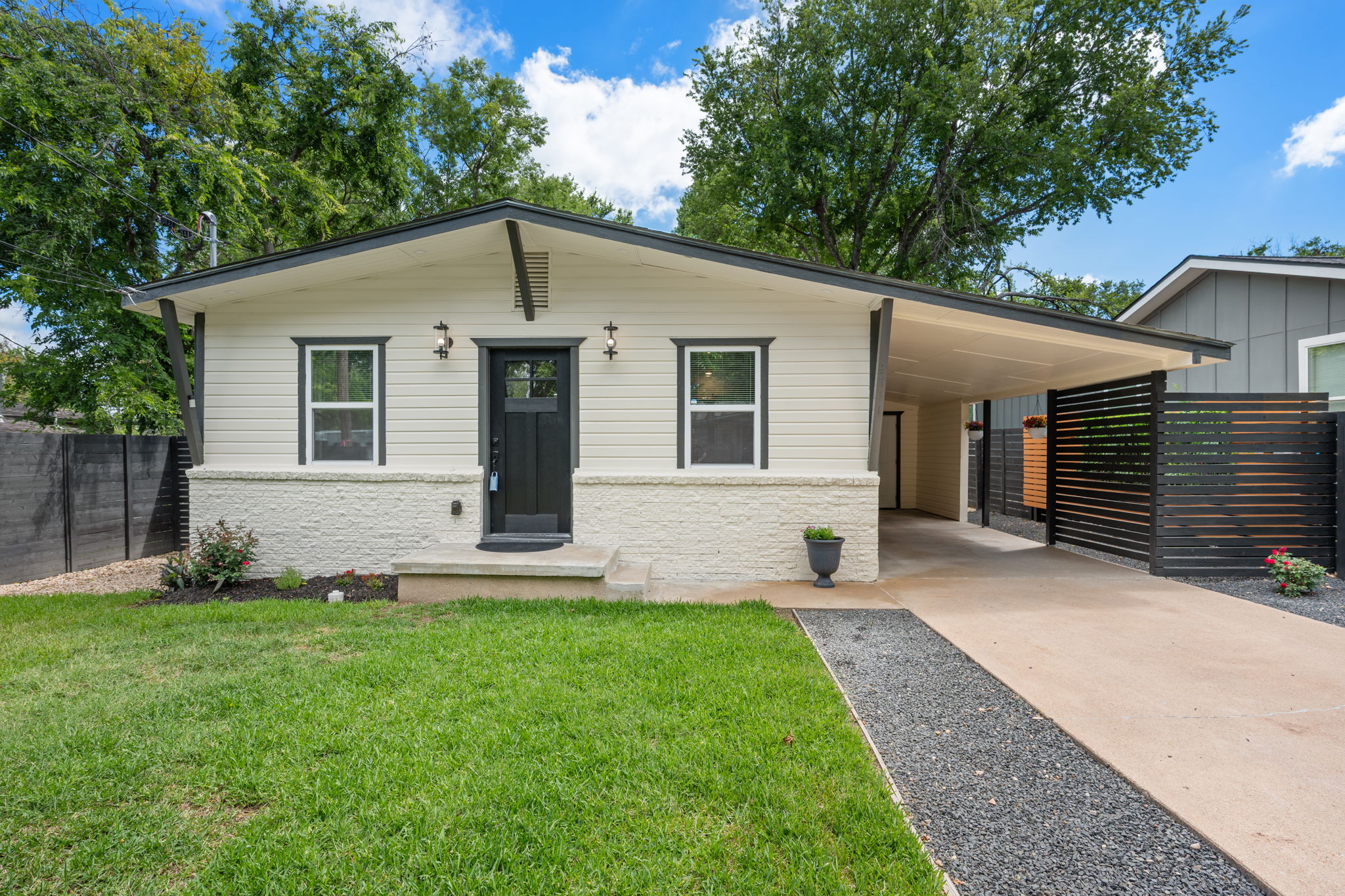 4711 Bandera Road Austin, TX 78721 - Photo 19 of 22 a view of a house with a yard and porch
