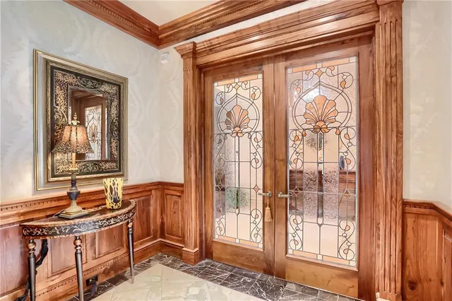 a bathroom with a sink a mirror and next to a window