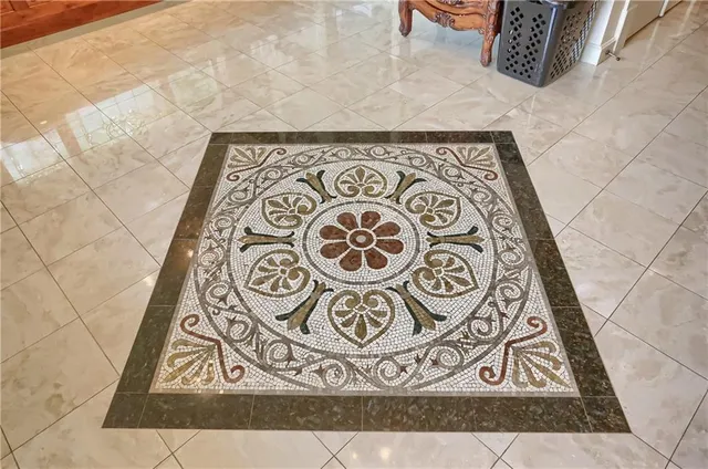 a spacious bathroom with a granite countertop tub shower and windows