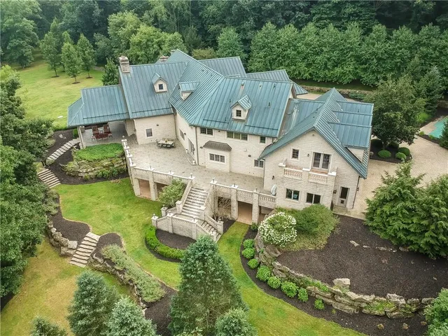 an aerial view of a house with a garden