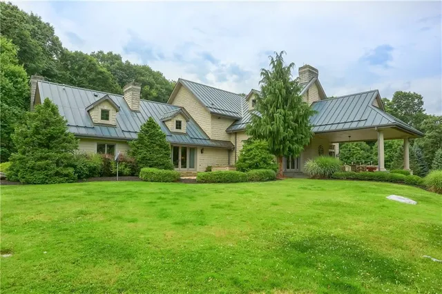 a building outdoor space with patio furniture and potted plants