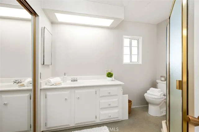 a bedroom with a bed and a chair