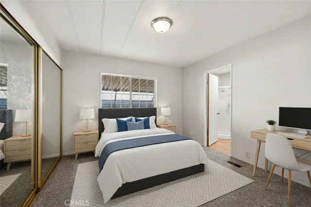 a living room with furniture and view of kitchen
