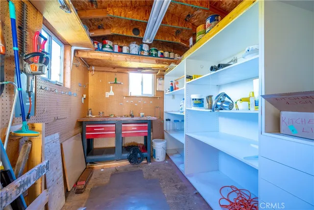 a backyard of a house with outdoor seating