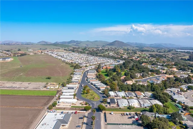 an aerial view of a house with a swimming pool yard and outdoor seating
