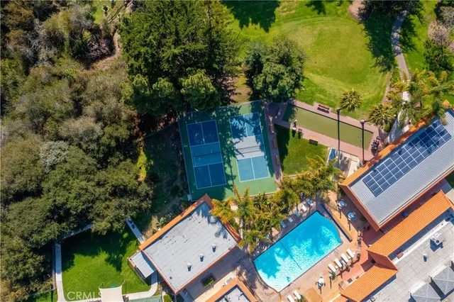 a view of a swimming pool with a yard