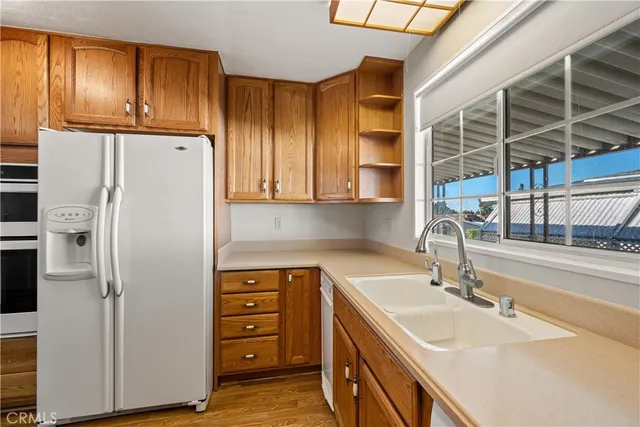 an empty room with a ceiling fan and a window