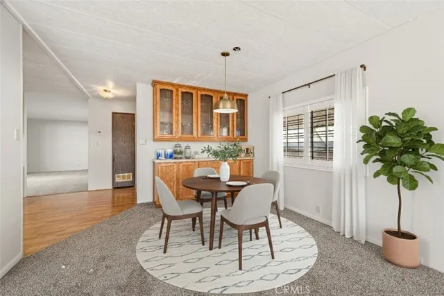 a kitchen with stainless steel appliances granite countertop a sink a stove and cabinets
