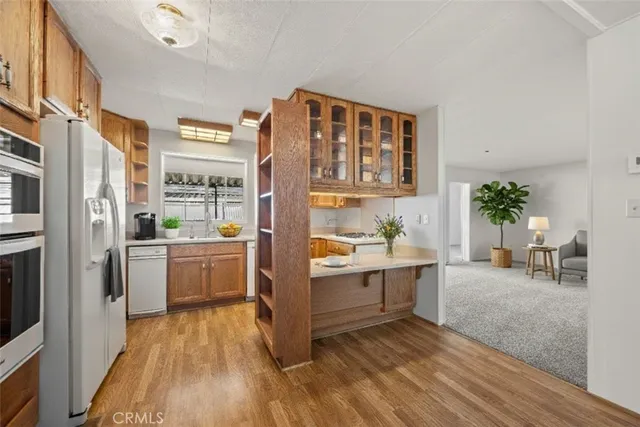 a living room with furniture wooden floor and a flat screen tv