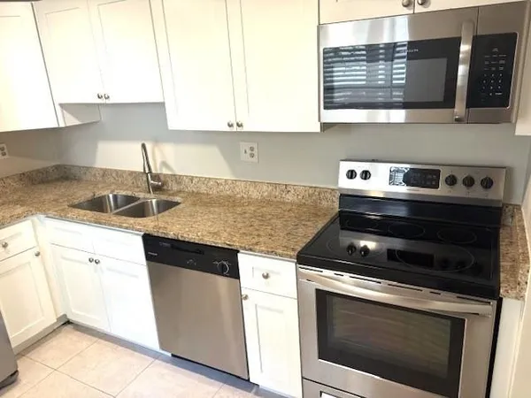 a kitchen with a stove and a sink